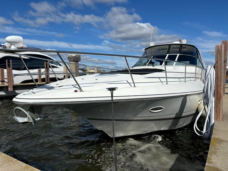 Slide: The Image of 2005 Cruisers Yachts 440 Express docked under a clear blue sky. - 3