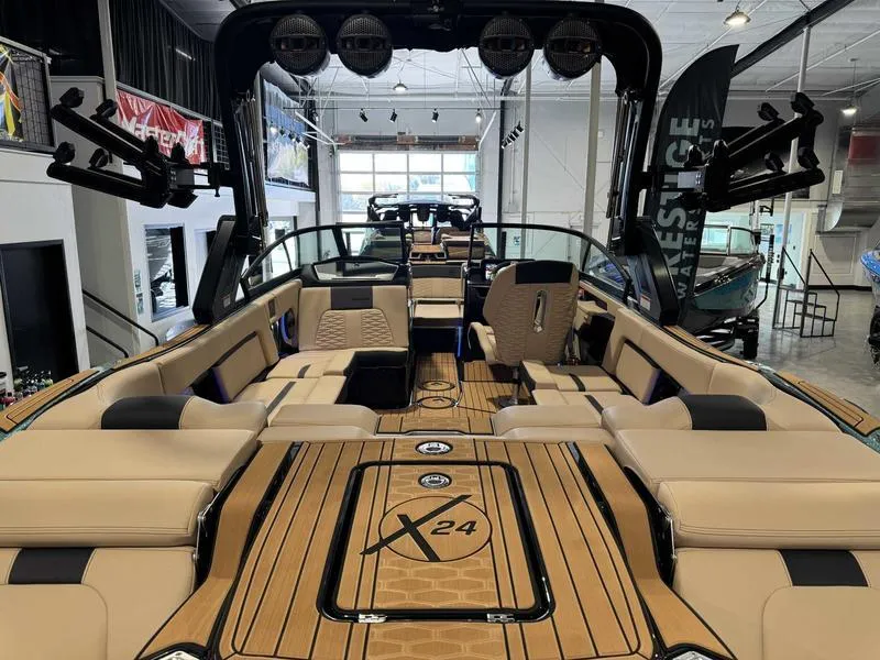 Slide: The Image of 2025 MasterCraft X24 boat interior with luxurious seating and modern design. - 6