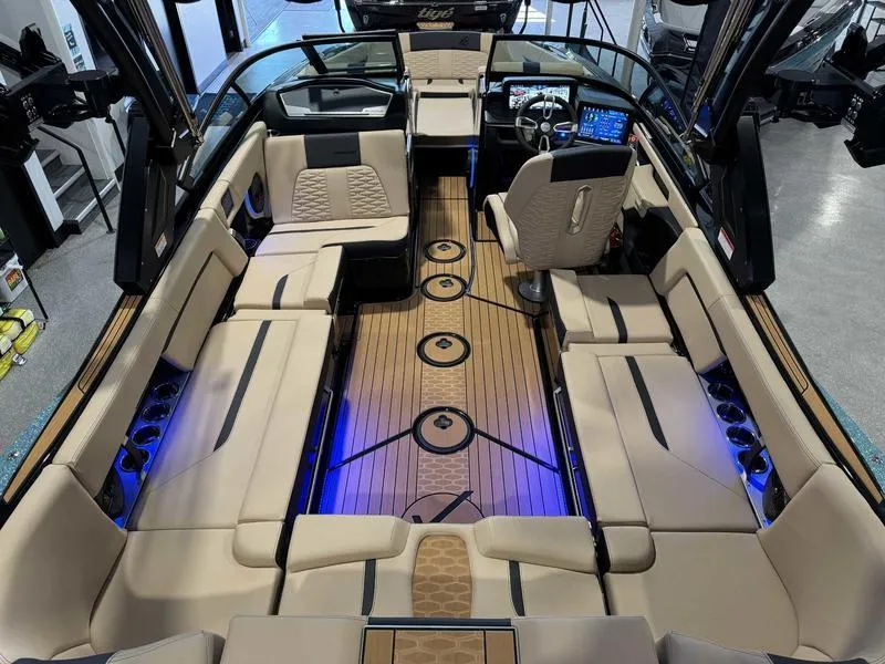 Slide: The Image of 2025 MasterCraft X24 boat interior with luxurious seating and modern dashboard. - 8