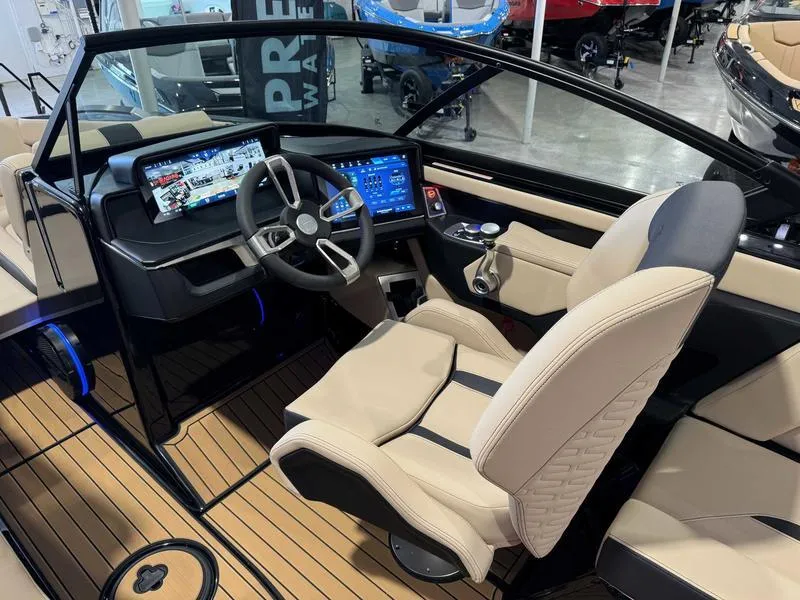 Slide: The Image of 2025 MasterCraft X24 boat interior with modern dashboard and luxurious seating. - 9
