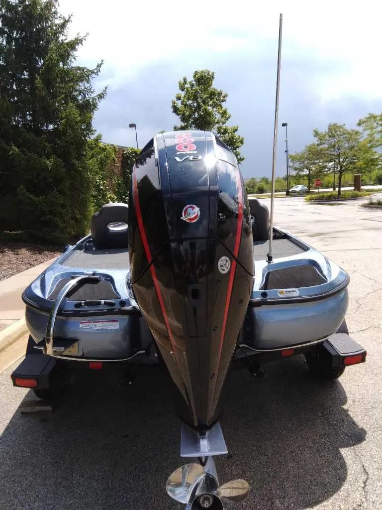 Slide: The Image of 2025 Nitro Z19 boat with powerful outboard motor, parked outdoors. - 4