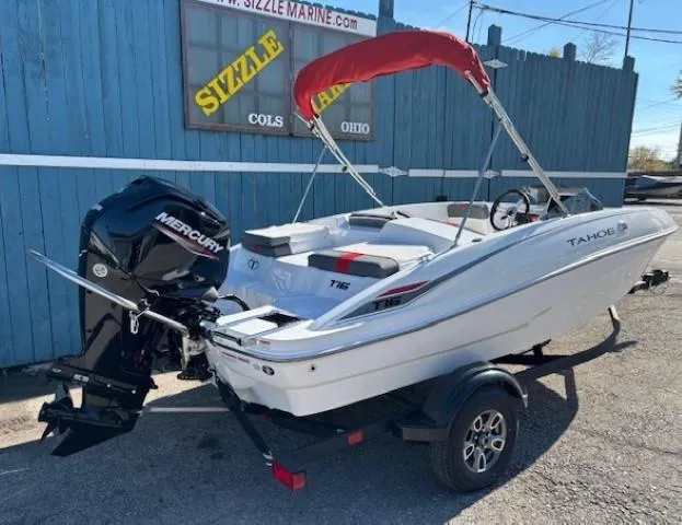Slide: The Image of 2025 Tahoe T16 boat with Mercury engine, red canopy, on trailer at Sizzle Marine. - 3