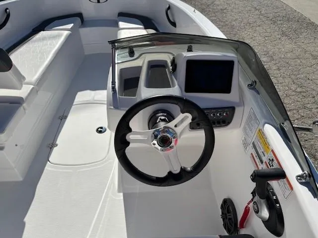 Slide: The Image of 2025 Tahoe T16 boat cockpit with steering wheel and dashboard controls. - 7