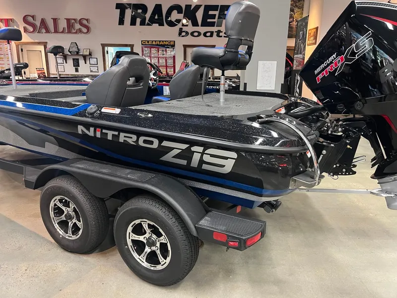 Slide: The Image of 2025 Nitro Z19 boat in showroom with Mercury Pro XS engine. - 1