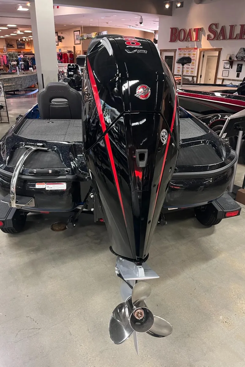 Slide: The Image of 2025 Nitro Z19 boat with sleek black and red design in showroom. - 10