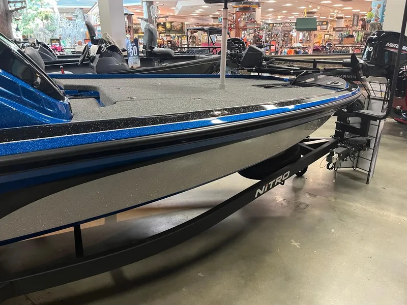 Slide: The Image of 2025 Nitro Z19 boat displayed in showroom, featuring sleek design and modern features. - 4