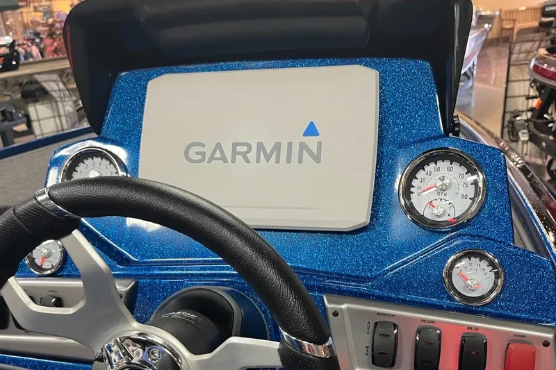 Slide: The Image of 2025 Nitro Z19 boat dashboard with Garmin display and gauges. - 7