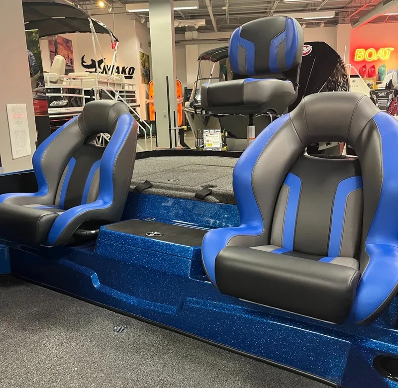 Slide: The Image of 2025 Nitro Z19 boat interior with blue and black seats in showroom. - 8