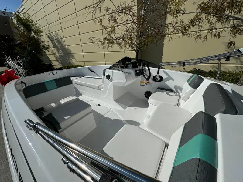 Slide: The Image of 2025 Tahoe T16 boat interior with modern seating and steering console. - 2
