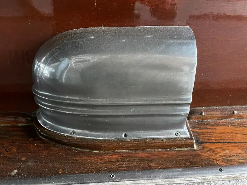 Slide: The Image of 1951 Chris-Craft Catalina boat detail with polished metal and wood finish. - 29