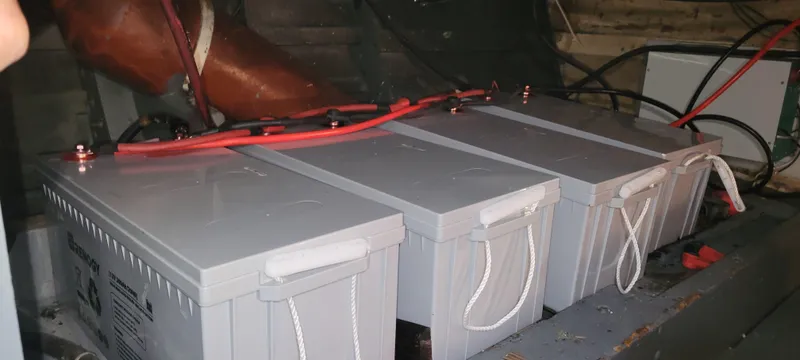 Slide: The Image of 1951 Chris-Craft Catalina boat batteries with red cables in engine compartment. - 36