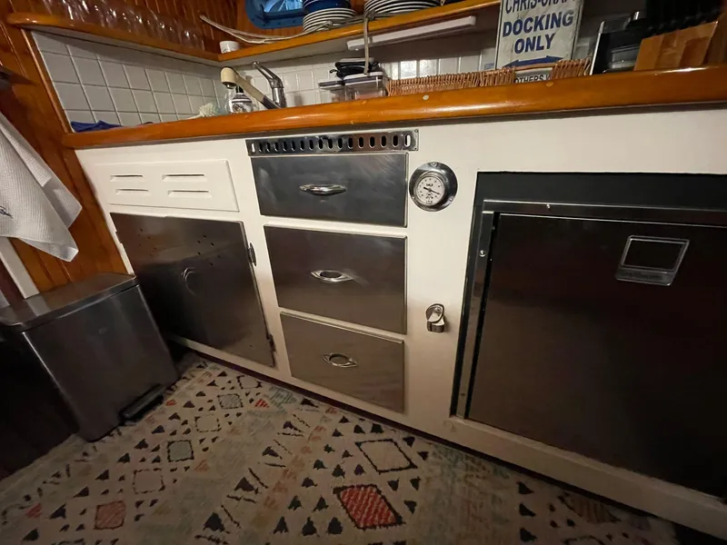 Slide: The Image of 1951 Chris-Craft Catalina kitchen with vintage cabinetry and stainless steel appliances. - 6