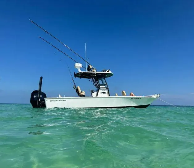 Slide: The Image of 2021 Sportsman MASTERS 247 BAY boat on clear turquoise water under blue sky. - 0