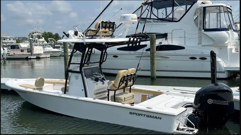 Slide: The Image of 2021 Sportsman MASTERS 247 BAY boat docked in marina, featuring Yamaha engine. - 1