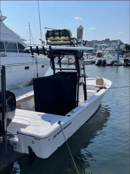 Slide: The Image of 2021 Sportsman MASTERS 247 BAY boat docked in a marina. - 2