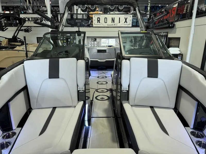 Slide: The Image of 2024 MasterCraft X24 boat interior with sleek seating and modern design. - 12