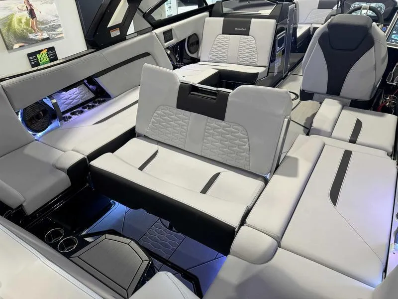 Slide: The Image of Luxurious interior of 2024 MasterCraft X24 boat with modern seating and ambient lighting. - 14