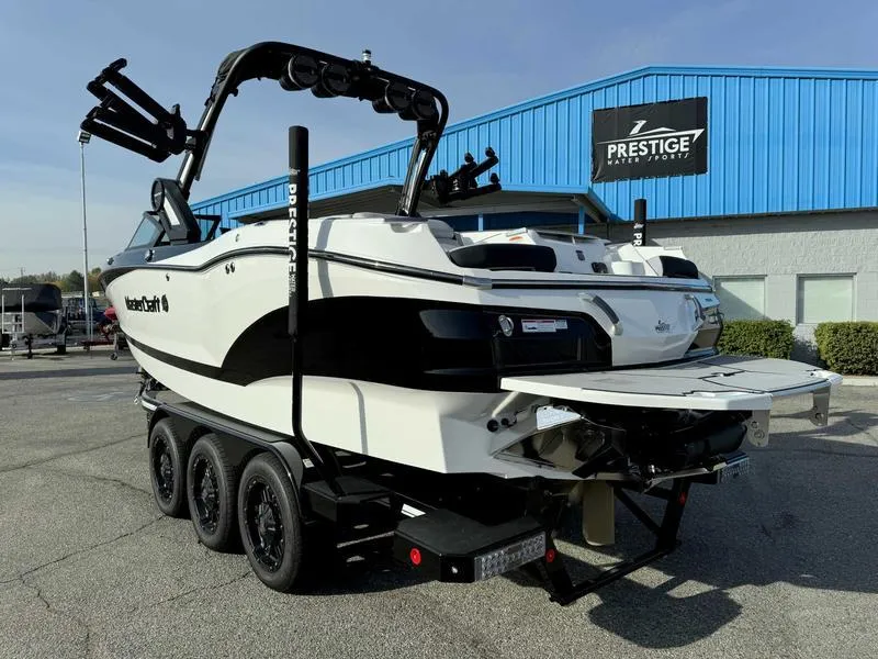 Slide: The Image of 2024 MasterCraft X24 boat on trailer at dealership, rear view. - 4