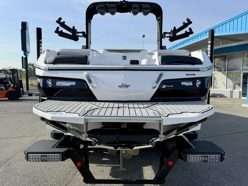 Slide: The Image of 2024 MasterCraft X24 boat, rear view, showcasing sleek design and modern features. - 5