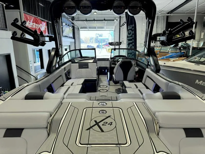 Slide: The Image of 2024 MasterCraft X24 boat interior with sleek seating and modern design. - 6