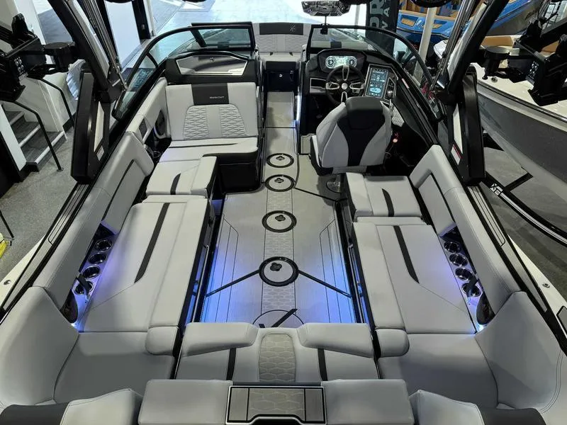 Slide: The Image of 2024 MasterCraft X24 boat interior with luxurious seating and modern dashboard. - 7