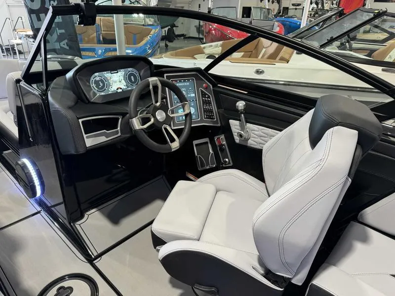 Slide: The Image of 2024 MasterCraft X24 boat interior with modern dashboard and steering wheel. - 8