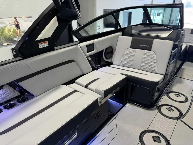Slide: The Image of 2024 MasterCraft X24 boat interior with luxurious seating and modern design. - 9