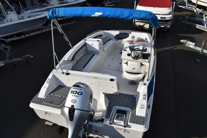 Slide: The Image of 2022 Starcraft SVX 171 boat with Honda 100 VTEC engine and blue canopy. - 10