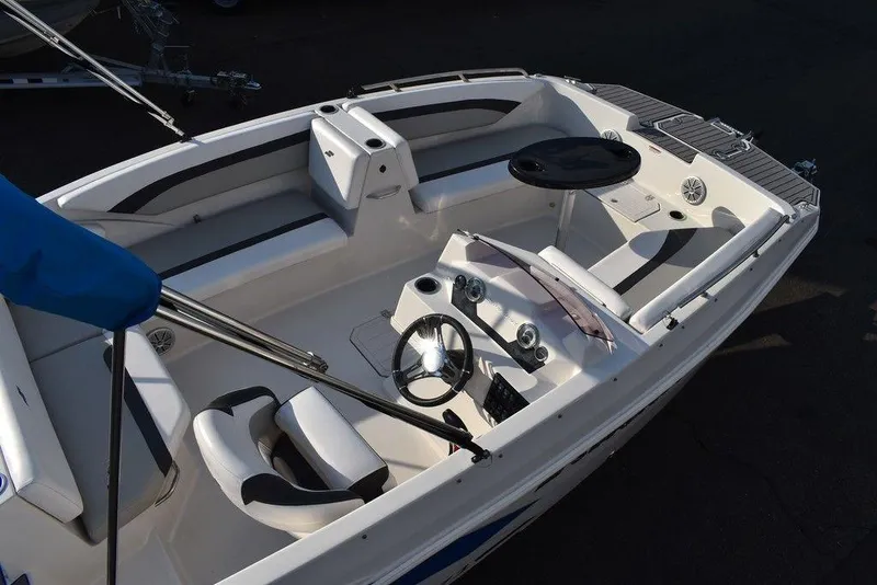 Slide: The Image of 2022 Starcraft SVX 171 boat interior with steering wheel and seating. - 13