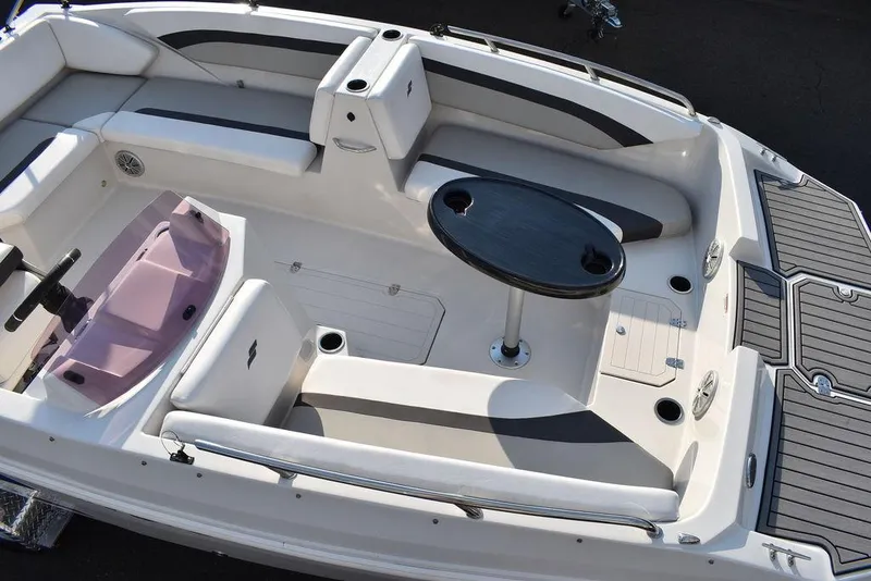 Slide: The Image of 2022 Starcraft SVX 171 boat interior with seating and table, featuring modern design and amenities. - 15