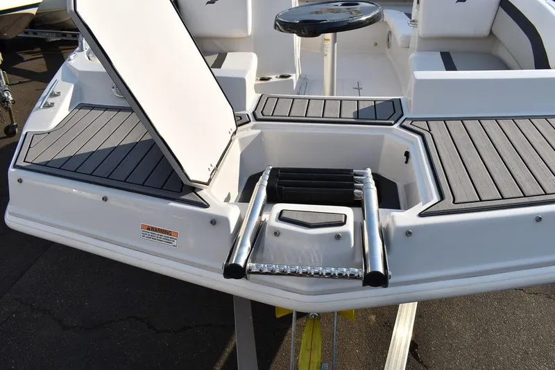 Slide: The Image of 2022 Starcraft SVX 171 boat with open storage and ladder. - 18