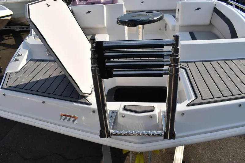Slide: The Image of 2022 Starcraft SVX 171 boat with open storage hatch and foldable ladder. - 19