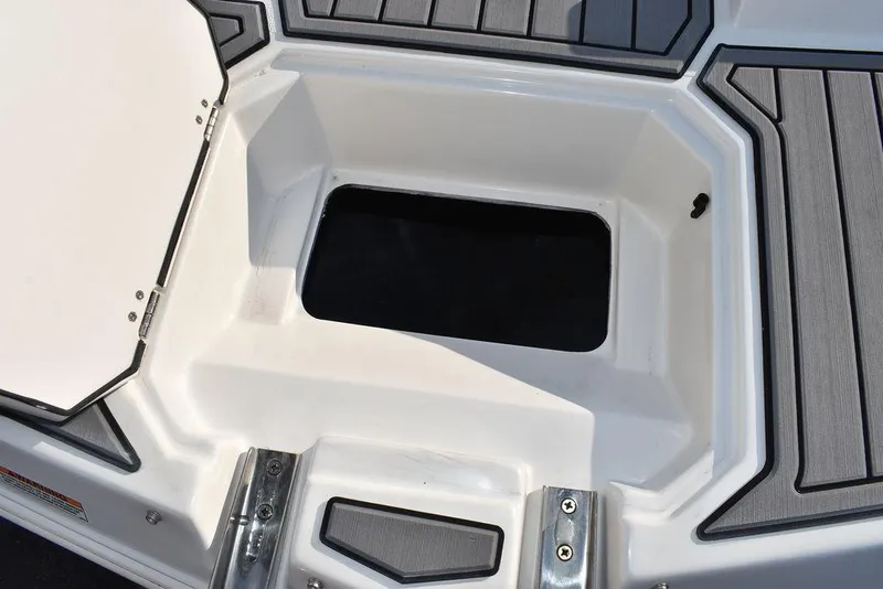 Slide: The Image of 2022 Starcraft SVX 171 boat storage compartment with open hatch, featuring sleek design. - 20