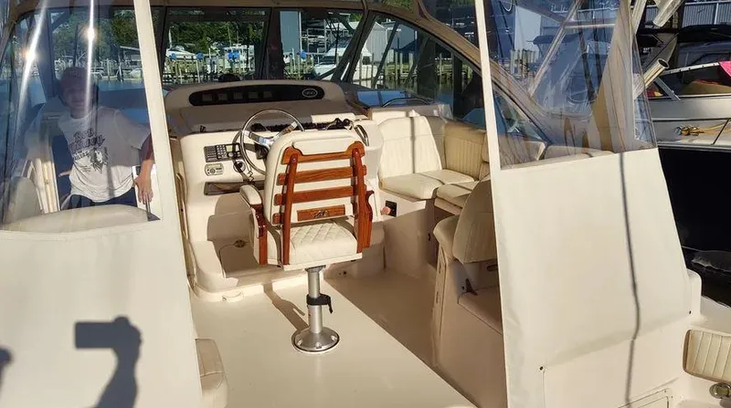 Slide: The Image of 2006 Grady-White Express 360 boat interior with helm and seating area. - 10