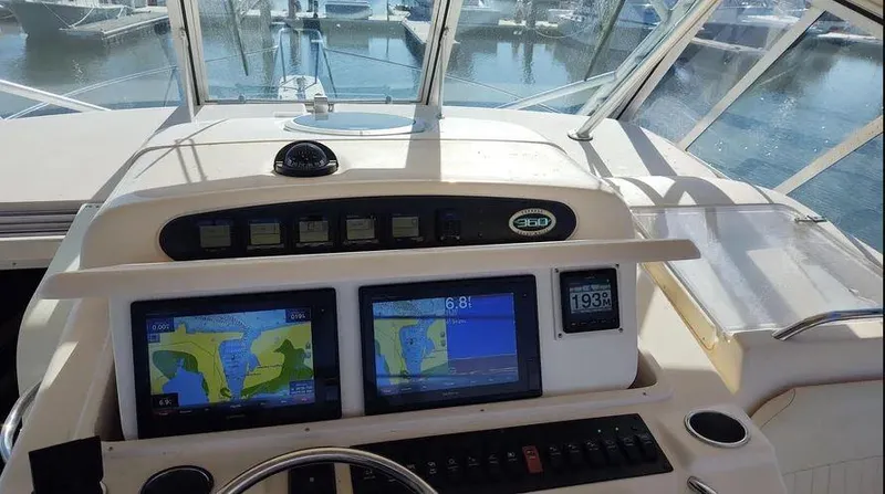 Slide: The Image of 2006 Grady-White Express 360 helm with navigation screens and controls. - 12