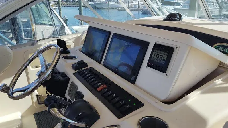 Slide: The Image of 2006 Grady-White Express 360 helm with modern navigation displays and controls. - 18