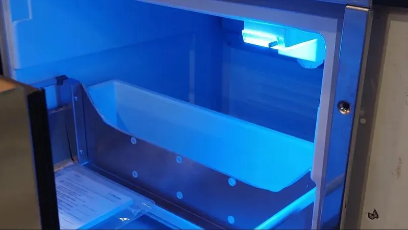 Slide: The Image of Blue-lit interior of a Grady-White Express 360 boat, 2006 model. - 19