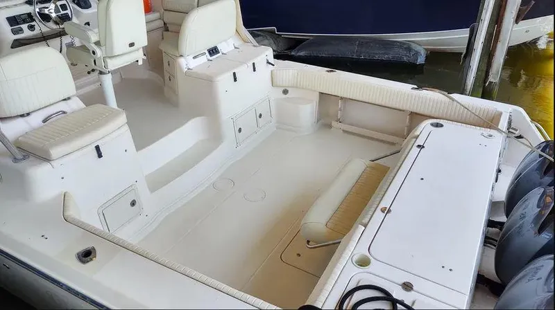 Slide: The Image of 2006 Grady-White Express 360 boat interior with seating and storage compartments. - 4