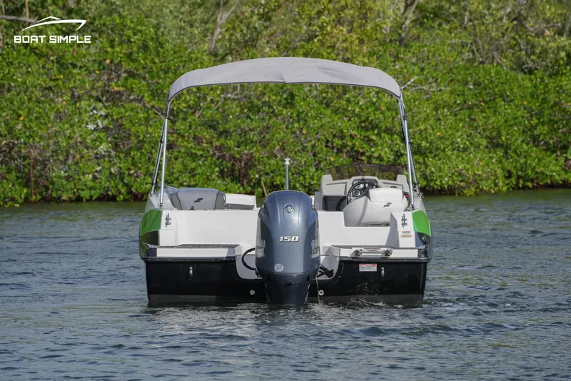 Slide: The Image of 2023 Starcraft SVX 191 OB boat on water, rear view with canopy. - 4