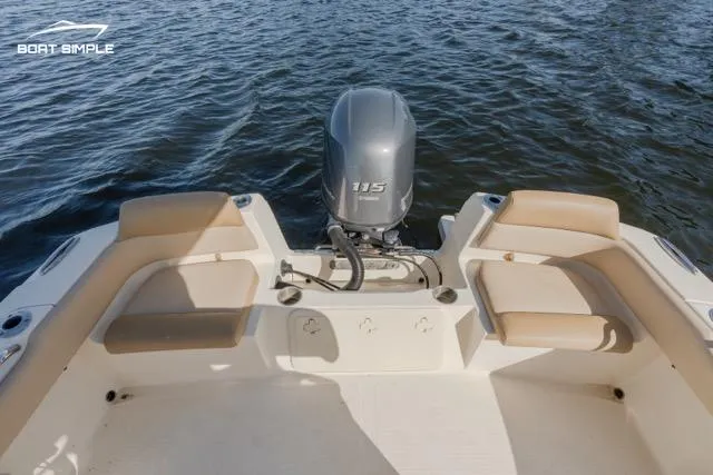 Slide: The Image of 2022 Scout 195 Sportfish boat with outboard motor on water. - 4