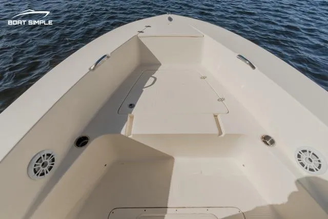 Slide: The Image of 2022 Scout 195 Sportfish boat interior with spacious deck on water. - 8