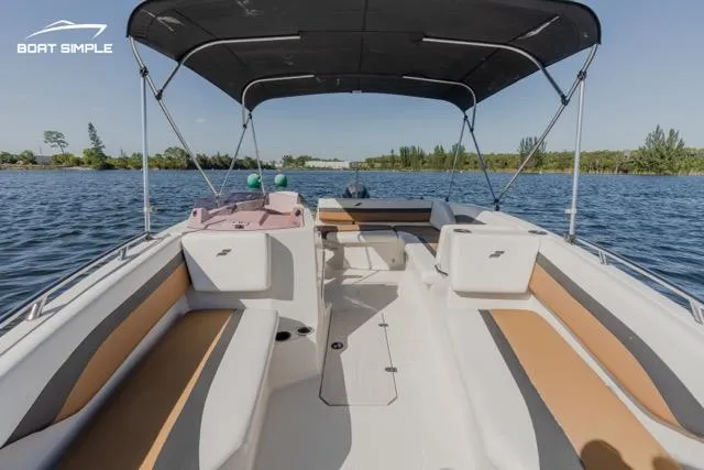 Slide: The Image of 2022 Starcraft SVX 171 OB boat interior with canopy on a sunny day. - 4