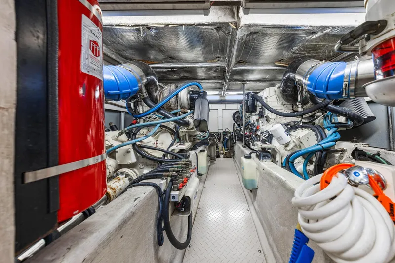 Slide: The Image of Engine room of 2007 Sea Ray 52 Sedan Bridge with visible machinery and equipment. - 15