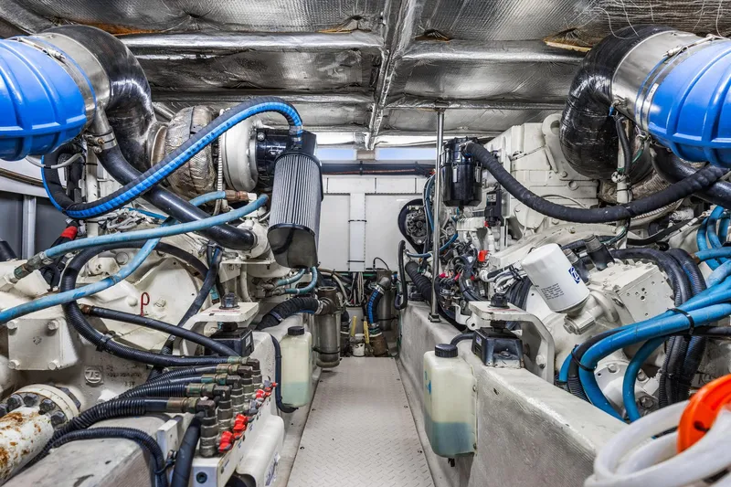 Slide: The Image of Engine room of a 2007 Sea Ray 52 Sedan Bridge yacht, showcasing complex machinery and components. - 16