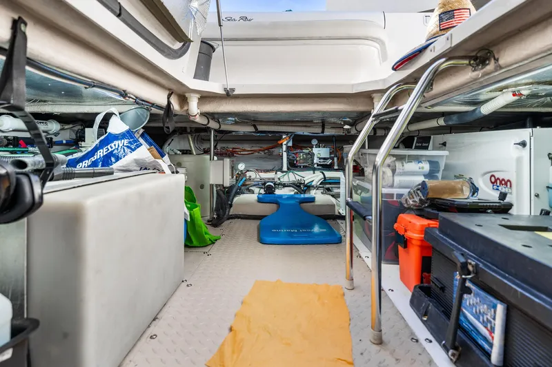 Slide: The Image of Engine room of 2007 Sea Ray 52 Sedan Bridge, showcasing equipment and storage. - 21