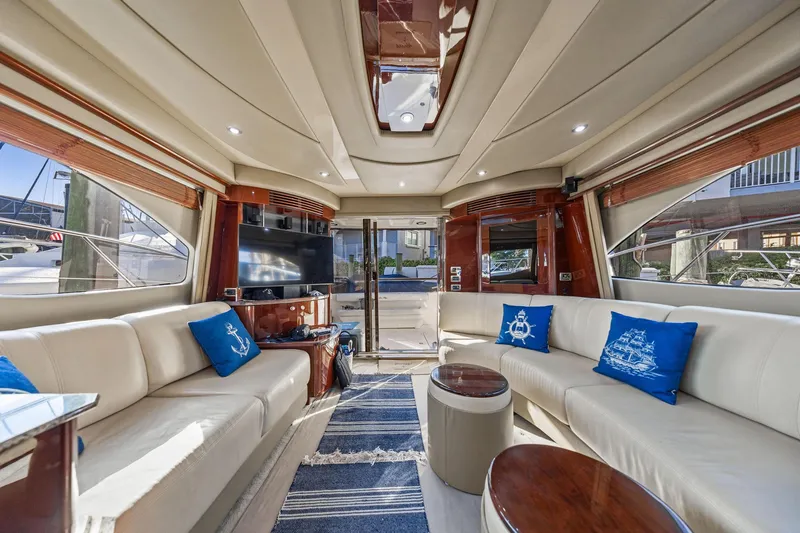 Slide: The Image of Luxurious interior of 2007 Sea Ray 52 Sedan Bridge yacht with elegant seating and decor. - 40