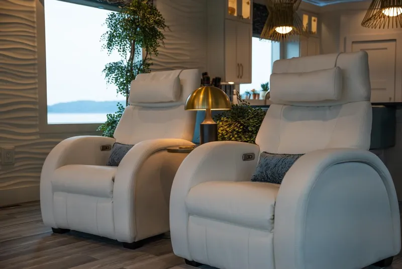 Slide: The Image of Luxurious interior of 2020 Thoroughbred houseboat with plush white recliners and elegant decor. - 5