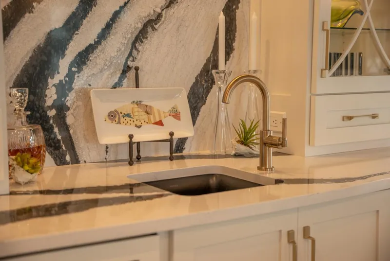 Slide: The Image of Modern houseboat kitchen sink with elegant marble backsplash and stylish decor, Thoroughbred model 2020. - 6