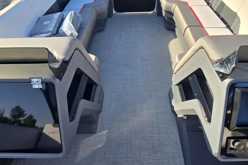 Slide: The Image of 2025 Manitou 240 Cruise interior with modern seating and spacious layout. - 11