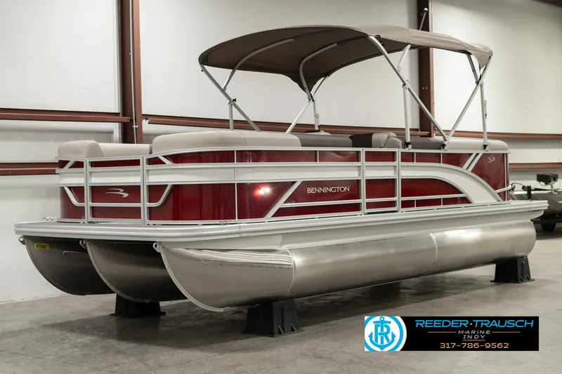 Slide: The Image of 2025 Bennington 21 SLSE pontoon boat with canopy in showroom. - 3